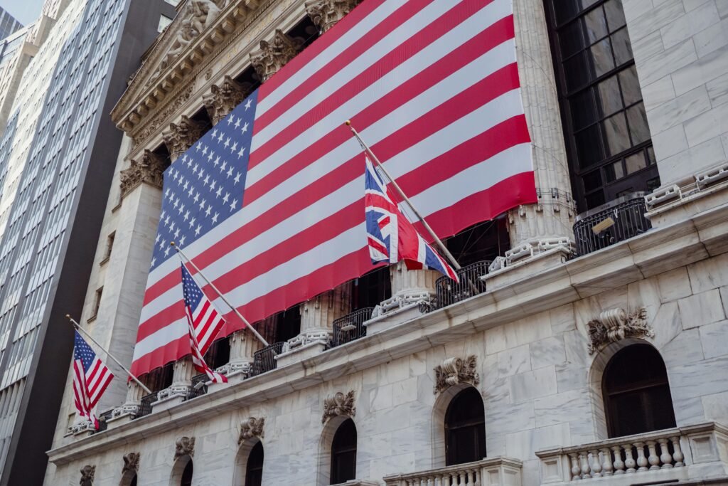 American flag on a historic building exterior symbolizing patriotism and national pride.